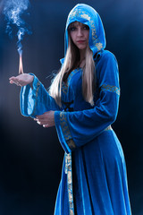 magician holding flame