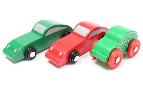 Old colorful toy cars isolated on white background