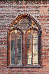 Gothic window in red brick wall of Dome Cathedral, Riga, Latvia