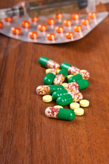 pills on a wooden background