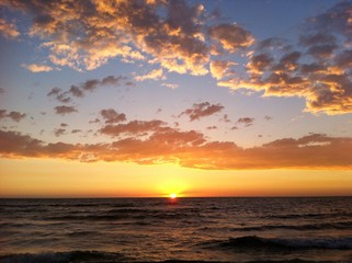 beautiful sunset with puffy clouds
