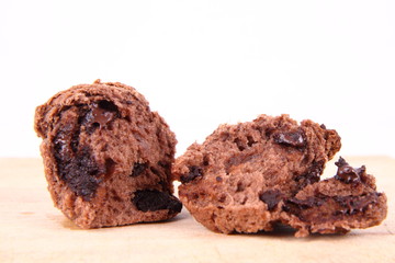 Chocolate muffins on a wooden background
