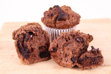 Chocolate muffins on a wooden background