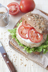 Fresh vegan sandwich with garbanzo beans, tomato and salad