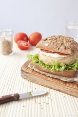 Fresh vegan sandwich with garbanzo beans, tomato and salad