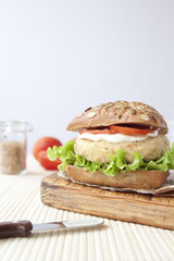 Fresh vegan sandwich with garbanzo beans, tomato and salad