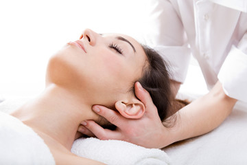 Fototapeta na wymiar Woman enjoying massage at beauty spa