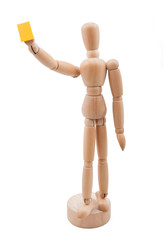 Wooden referee shows yellow card