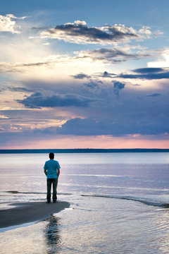 Alone Man At Sea In Sunset
