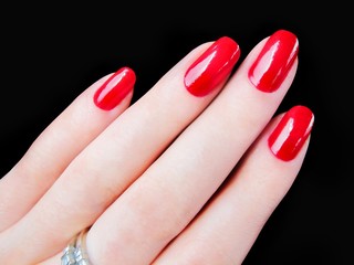 Beautiful pretty womans hand fingers sexy red fingernails nails