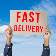 Man hand holding paper with fast delivery word