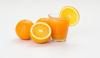 Orange juice and slice on white background