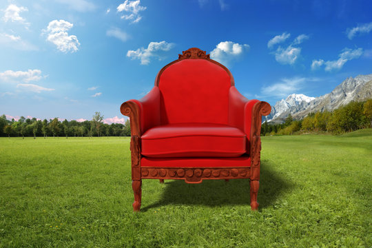 Red armchair in the nature