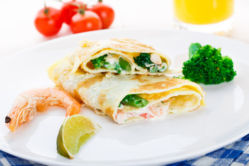 Fototapeta na wymiar Omelet with shrimps and vegetables