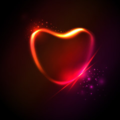 Bright lighting heart at dark background