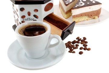 cup of black coffee with beans and dessert