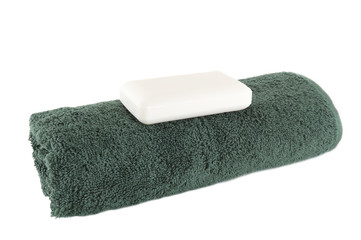 green towel with a piece of soap