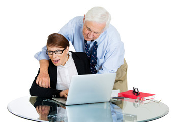 Portrait of old man harassing young woman at workplace