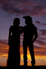 cowboy couple stand silhouette look at each other