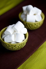 Fototapeta na wymiar Two national oriental bowls with white marshmallows