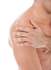 Young Man Suffering From Shoulder Pain