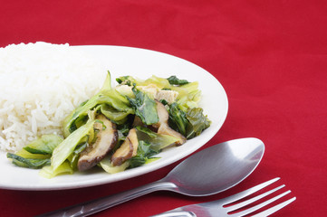 Stir-fried brassica vegetarian with spoon and fork