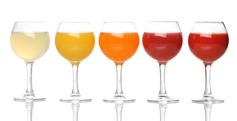 Tropical juices in glasses isolated on white