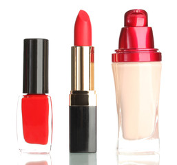 Beautiful red lipstick, nail polish and foundation, isolated