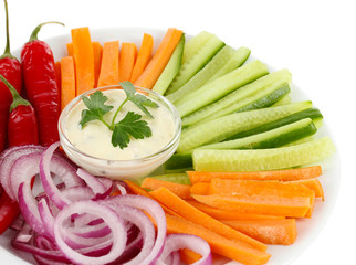 Assorted raw vegetables sticks in plate isolated on white