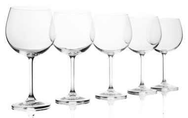 Empty wine glasses arranged and isolated on white