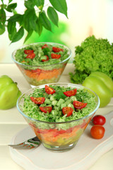 Tasty salad with fresh vegetables on wooden table