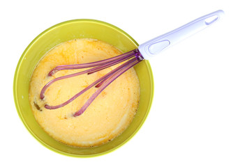 Corolla and broken eggs in bowl isolated on white