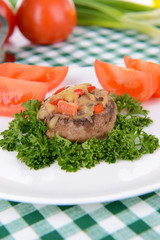 Stuffed mushrooms on plate on table close-up