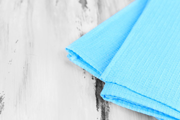 Kitchen towels on wooden background