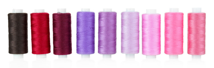 Colored spools of threads isolated on white