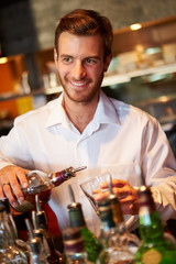 Barman Serving Drinks In Nightclub
