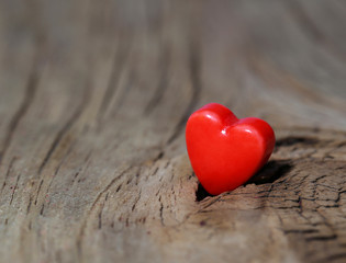 Fototapeta premium Valentines Day background. Hearts on Wooden Texture. Macro