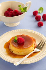 Creme caramel with raspberries.