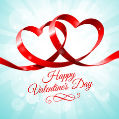 Red ribbon with two hearts intertwined