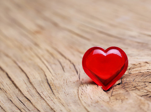 Valentines Day. Red Heart on Wooden background. Macro