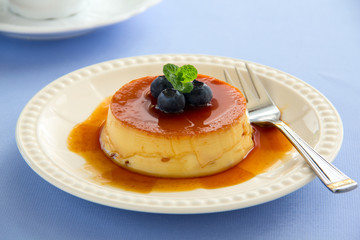 Creme caramel with fresh blueberries.