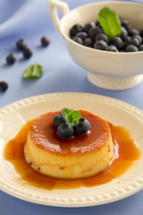 Creme caramel with fresh blueberries.