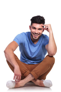 young pensive casual man sitting relaxed