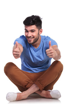 seated casual man making the ok sign