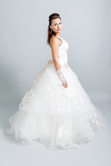 Fototapeta na wymiar beautiful girl in a white wedding dress profile