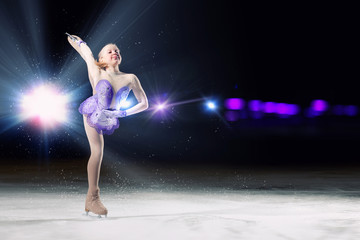 Fototapeta na wymiar Little girl figure skating