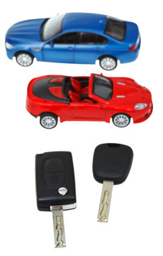 top view two vehicle keys and model cars
