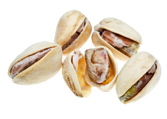 several salted pistachio nuts close up