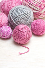 Fototapeta na wymiar balls of pink and gray yarn