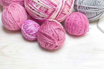 balls of pink and gray yarn